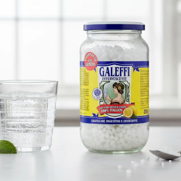 Granulés effervescents Galeffi se dissolvant dans un verre d’eau pour une boisson digestive.